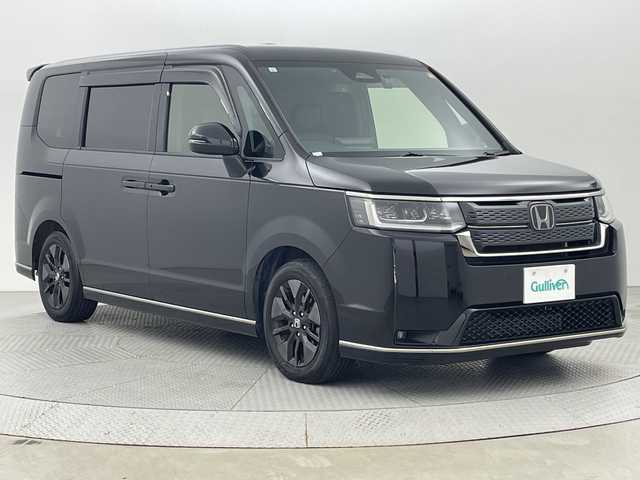 ホンダ ステップワゴン スパーダ 新潟県 2023(令5)年 1.8万km クリスタルブラックパール ギャザズ11.4型メモリナビ/CD/DVD/BT/バックカメラ/ETC/フルセグ/純正15型フリップダウンモニター/両側パワースライドドア/パワーテールゲート/オートクルーズ/シートヒーター　D席/N席/純正アルミ16インチ/ホンダセンシング/ハーフレザーシート