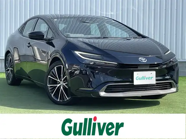 トヨタ プリウス Z 香川県 2024(令6)年 2.6万km アティチュードブラックマイカ 登録時走行距離：25892km/メーカー純正12.3型メモリナビ/　BT接続　フルセグTV/全方位カメラ/パーキングサポート/プリクラッシュセーフティシステム/レーダークルーズコントロール/レーンキープアシスト/クリアランスソナー/ブラインドスポットモニター/オートハイビーム/LEDヘッドライト/オートライト/ブラックレザーシート/シートヒーター/シートベンチレーション/パワーシート/シートメモリ/革巻きステアリング/ステアリングスイッチ/ステアリングヒーター/AC100V充電/置くだけ充電/ビルトインETC2.0/プッシュスタート/スマートキー