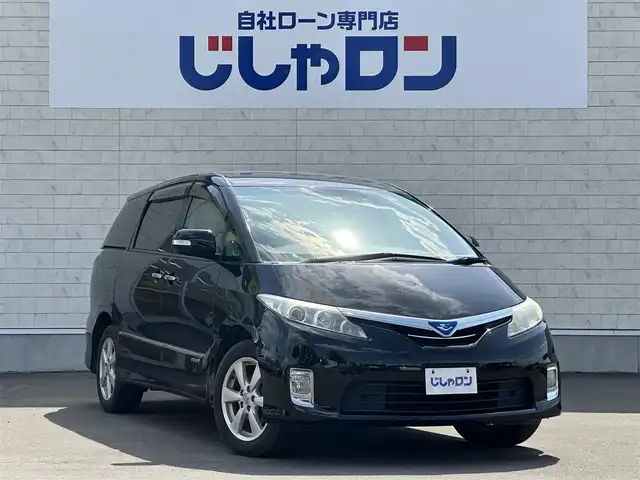 トヨタ エスティマ ハイブリッド X 道北・旭川 2012(平24)年 9.4万km ブラック (株)IDOMが運営する【じしゃロン旭川店】の自社ローン専用車両になります。こちらは現金またはオートローンご利用時の価格です。自社ローンご希望の方は別途その旨お申付け下さい/　/・社外オーディオ(BT)/・ETC/・クルーズコントロール/・バックカメラ/・両席パワースライドドア/・スマートキー2個