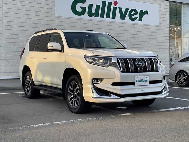 トヨタ ランドクルーザー プラド TX Lパッケージ 静岡県 2023(令5)年 1.7万km ホワイトパールクリスタルシャイン メーカーナビ/地デジTV/バック/全周囲カメラ/モデリスタエアロ/サンルーフ/レザーシート＆エアシート/純正19インチAW/2.0ETC/スマートキー/保証書/取説
