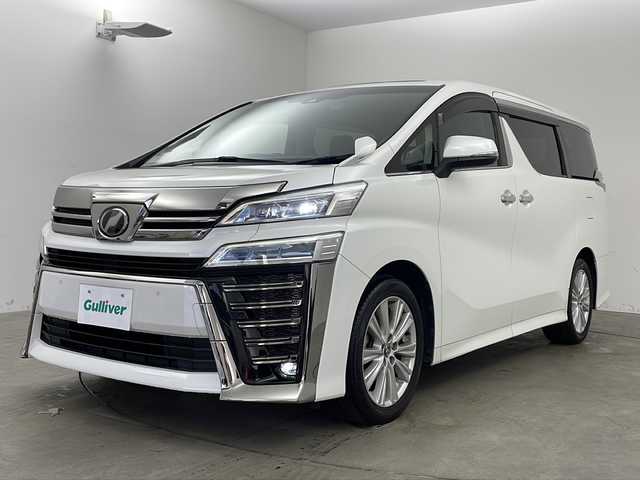トヨタ ヴェルファイア Z 兵庫県 2018(平30)年 4.7万km ホワイトパールクリスタルシャイン ・純正10インチナビ/CD/DVD/BT/SD/TV/・ツインムーンルーフ/・トヨタセーフティセンス/・レーダークルーズコントロール/・レーントレーシングアシスト/・クリアランスソナー/・パーキングサポートブレーキ/・プリクラッシュセーフティ/・ブラインドスポットモニター/・ロードサインアシスト/・先行車発進告知/・オートマチックハイビーム/・LEDオートライト/・フォグランプ/・両側パワースライドドア/・バックカメラ/・nanoe/・TVキット/・ビルトインETC/・前後ドライブレコーダー/・オットマン/・電動パーキングブレーキ/・ブレーキホールド/・横滑り防止装置/・純正18インチアルミホイール/・純正フロアマット/・レーダー探知機/・ステアリングリモコン/・ドアバイザー/・パワーバックドア/・スマートキー/・スペアキー/・プッシュスタート/・MTモード付AT/・デジタルインナーミラー/・革巻きステアリング/・WAC/・オールオートパワーウィンドウ/・W＋サイドエアバッグ/・カーテンエアバッグ
