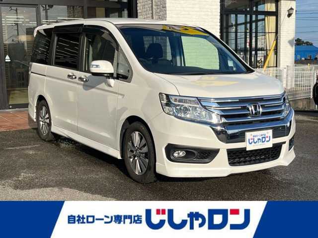 ホンダ ステップワゴン スパーダ Z 高知県 2014(平26)年 10万km ホワイトオーキッドパール (株)IDOMが運営する【じしゃロン高知店】の自社ローン専用車両になります。こちらは現金またはオートローンご利用時の価格です。自社ローンご希望の方は別途その旨お申付け下さい/	ナビ装着用スペシャルパッケージ/	リア左側パワースライドドア＋リア両側イージードアクローザー/	リア右側パワースライドドア/	ディスチャージヘッドライト＜HID＞（ロービーム、オートレベリング/オートライトコントロール機構付）/	アクティブコーナリングライト/	Hondaスマートキーシステム（Hondaスマートキー2個付）/	１６インチアルミホイール＋スチールラジアルタイヤ（205/60R16 92H）/	コンフォートビューパッケージ［親水/ヒーテッドドアミラー+フロントドア撥水ガラス］/	クルーズコントロール/	スーパーＵＶカットフロントドアガラス