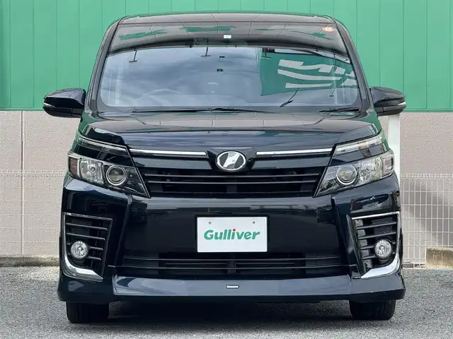 トヨタ ヴォクシー ZS 千葉県 2015(平27)年 7.8万km ブラッキッシュアゲハガラスフレーク 純正９インチメモリナビ/CD/DVD/Bluetooth/フルセグ/純正フリップダウンモニター/モデリスタエアロ/両側パワースライドドア/バックカメラ/ドアバイザー/ドライブレコーダー/ビルトインETC/純正１６インチAW/純正フロアマット/プッシュスタート/スマートキー
