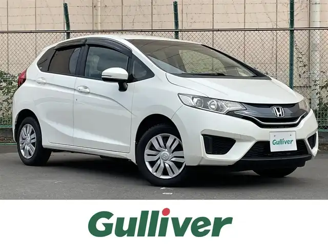ホンダ フィット 13G Lパッケージ 東京都 2014(平26)年 7.5万km プレミアムホワイトパール 純正ナビ/CD再生/AM／FM/バックモニター/ECONモード/アイドリングストップ/横滑り防止措置/ステアリングスイッチ/ワイパーデアイザー/スマートキー/純正フロアマット/純正LEDヘッドライト