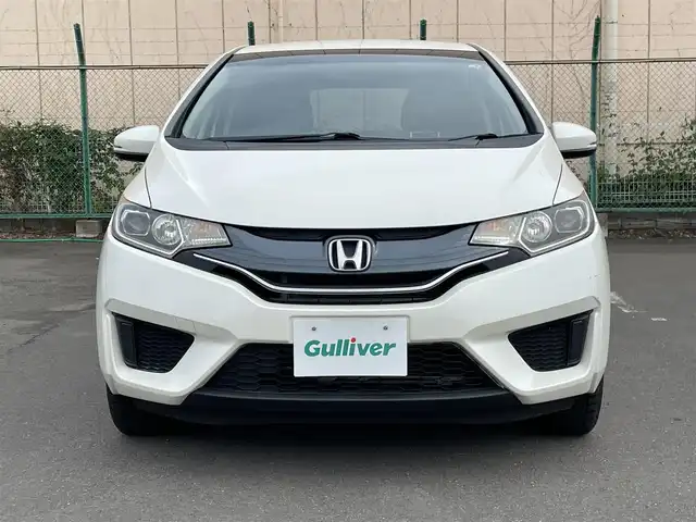 ホンダ フィット 13G Lパッケージ 東京都 2014(平26)年 7.5万km プレミアムホワイトパール 純正ナビ/CD再生/AM／FM/バックモニター/ECONモード/アイドリングストップ/横滑り防止措置/ステアリングスイッチ/ワイパーデアイザー/スマートキー/純正フロアマット/純正LEDヘッドライト