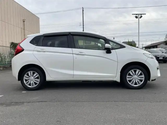 ホンダ フィット 13G Lパッケージ 東京都 2014(平26)年 7.5万km プレミアムホワイトパール 純正ナビ/CD再生/AM／FM/バックモニター/ECONモード/アイドリングストップ/横滑り防止措置/ステアリングスイッチ/ワイパーデアイザー/スマートキー/純正フロアマット/純正LEDヘッドライト