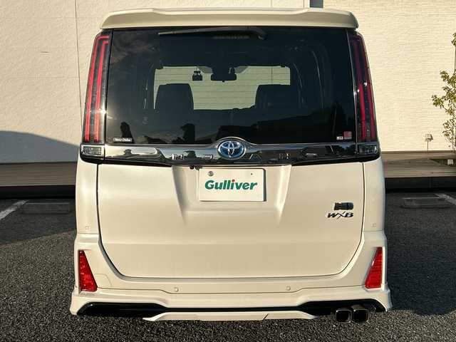 トヨタ ノア ハイブリッド Si ダブルバイビーⅢ 東京都 2021(令3)年 4.1万km ホワイトパールクリスタルシャイン モデリスタエアロ　10型ナビNSZN-Z68T　フリップダウンモニター　バックカメラ　両側電動スライドドア　シートヒーター　セーフティセンス　２．０ETC　クルコン　ドラレコ　コンビハンドル　LED