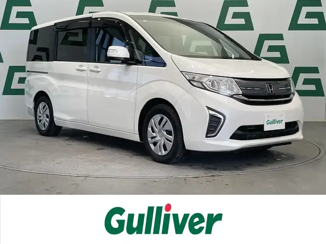 ホンダ ステップワゴン G ホンダセンシング 鹿児島県 2017(平29)年 5.7万km ホワイトオーキッドパール 禁煙車/純正ナビ/バックカメラ/両側パワースライドドア/ホンダセンシング/・クルーズコントロール/・衝突被害軽減ブレーキ/・車線維持支援システム/・誤発進抑制機能/・路外逸脱抑制機能/・先行者お知らせ機能/・標識認識機能/わくわくゲート/フルオートエアコン/ドアバイザー/純正フロアマット/電動格納ミラー/ETC
