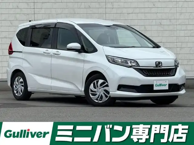 ホンダ フリード G ホンダセンシング 福岡県 2022(令4)年 0.9万km プラチナホワイトパール 純正9型SDナビ(フルセグTV/CD/DVD/BT)バックモニターホンダセンシングレーダークルコン両側パワスラドラレコETCシートヒーターUSBポート純正LEDヘッドライト純正フロアマットスマートキープッシュスタート
