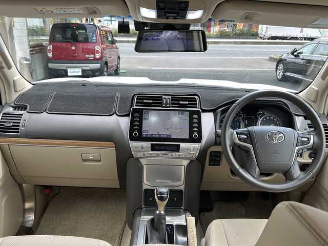 トヨタ ランドクルーザー プラド TX Lパッケージ 埼玉県 2022(令4)年 2.1万km ホワイトパールクリスタルシャイン 純正ナビ（TV／BT／AM／FM）/ETC2.0/スペアタイヤ/前席シートヒーター/前席パワーシート/デジタルインナーミラー　/レーンアシスト　/クルーズコントロール　/コーナーセンサー　/電格ミラー　/衝突軽減　/ISOFIX/フルエアロ（モデリスタ）/社外マフラー（モデリスタ）/バックカメラ/プッシュスタート/ライトウォッシャー/ライトレベライザー/ルーフレール/3列シート