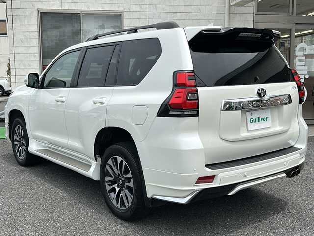 トヨタ ランドクルーザー プラド TX Lパッケージ 埼玉県 2022(令4)年 2.1万km ホワイトパールクリスタルシャイン 純正ナビ（TV／BT／AM／FM）/ETC2.0/スペアタイヤ/前席シートヒーター/前席パワーシート/デジタルインナーミラー　/レーンアシスト　/クルーズコントロール　/コーナーセンサー　/電格ミラー　/衝突軽減　/ISOFIX/フルエアロ（モデリスタ）/社外マフラー（モデリスタ）/バックカメラ/プッシュスタート/ライトウォッシャー/ライトレベライザー/ルーフレール/3列シート