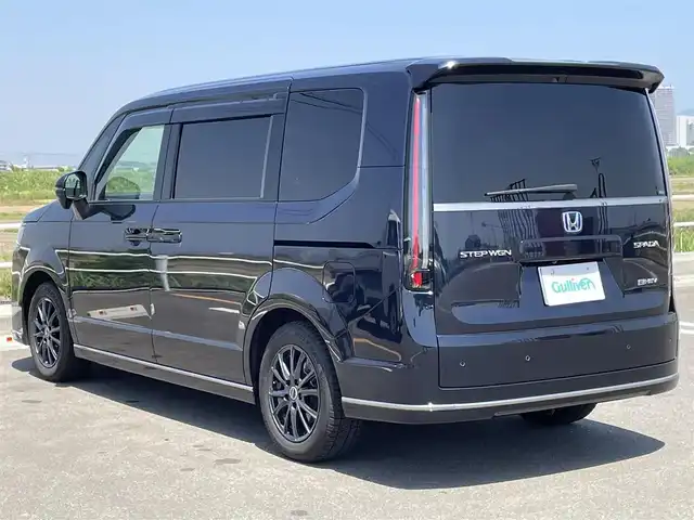 ホンダ ステップワゴン スパーダ eHEV 佐賀県 2022(令4)年 4.8万km ミッドナイトブルービームM 純正11.4インチナビ/・フルセグTV/CD/DVD/SD/USB/Bluetooth/純正15.6インチフリップダウンモニター/全周囲カメラ/デジタルインナーミラー/両側パワースライドドア/電動リアゲート/ビルトインETC/前後ドライブレコーダー/電動パーキングブレーキ/オートホールド機能/ハーフレザーシート/D＋N席シートヒーター/社外16インチアルミホイール/革巻きステアリング/ステアリングリモコン/オートライト/純正LEDフォグライト/純正LEDヘッドライト/純正ドアバイザー/ホンダセンシング/・衝突軽減ブレーキ/・レーダークルーズコントロール/・コーナーセンサー/・ブラインドスポットモニター/新車保証書/取扱説明書