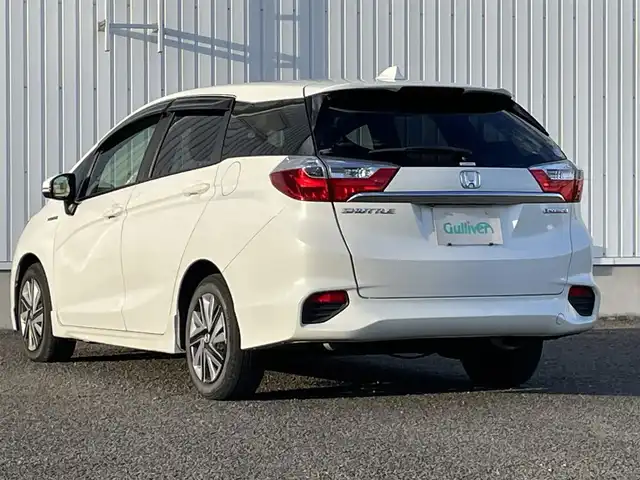 ホンダ シャトル ハイブリッド X ホンダセンシング 熊本県 2018(平30)年 11.2万km ホワイトオーキッドパール 純正ナビ（Gathers　VXM-187VFEi)/フルセグTV/BT/CD/DVD/USB/HDMI/ipod)/バックカメラ/純正フロアマット/ホンダセンシング/・路外逸脱抑制機能/・衝突軽減ブレーキ/・先行車発進お知らせ機能/・横滑り防止/・アダプティブクルーズコントロール/・車両接近お知らせ/・標識認識機能/・誤発進抑制機能/・歩行者事故低減ステアリング/・車線維持支援システム/・オートハイビーム/ハーフレザーシート/・D/Nシートヒーター/革巻きステアリング/・パドルシフト/・ステアリングリモコン/オートライト/・フォグライト/・LEDヘッドライト/ドアバイザー/スマートキー/・スペアキー×１