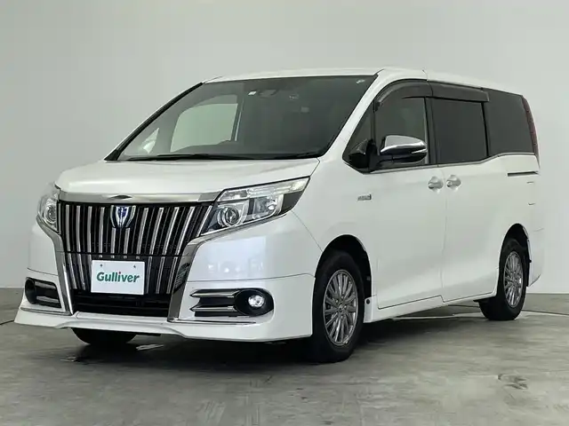 トヨタ エスクァイア ハイブリッド Gi ブラックテーラード 群馬県 2016(平28)年 6万km ホワイトパールクリスタルシャイン フリップダウンモニター　純正１０インチナビ　バックカメラ　両側パワースライドドア　ＬＥＤライト　ＡＨＢ　シートヒーター　純正１５インチＡＷ　ステアリングリモコン　ＥＴＣ　スマートキー　禁煙車