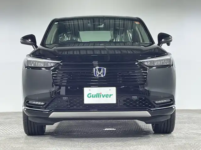 ホンダ ヴェゼル ハイブリッド e:HEV Z 神奈川県 2025(令7)年 0.1千km クリスタルブラックパール 登録済未使用車/ホンダセンシング/純正ディスプレイオーディオ/・BT/フルセグTV/AppleCarPlay/AndroidAuto/USB/AM/FM/バックカメラ/電動リアゲート/Qi充電/ハーフレザーシート/シートヒーター(D/N)/革巻きステアリング/ステアリングスイッチ/ステアリングヒーター/Autoライト/パドルシフト/ダウンヒルアシストコントロール/電動パーキングブレーキ/オートホールド/ビルトインETC2.0/クリアランスソナー/LEDヘッドライト/LEDフォグランプ/スマートキー/スペアキー/プッシュスタートボタン/シートリフター/電動格納ミラー/ウィンカーミラー/純正18インチアルミホイール