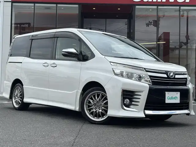 トヨタ ヴォクシー ZS 煌 宮城県 2016(平28)年 7.5万km ホワイトパールクリスタルシャイン 登録時走行距離74578km/純正SDナビ/フルセグTV/CD/DVD/Bluetooth/トヨタセーフティセンス/オートハイビーム/レーンディパーチャーアラート/フリップダウンモニター/両側パワースライド/プッシュスタート/スマートキー/革巻きステアリング/バックカメラ/ビルトインETC/ステアリングリモコン/サンシェード/横滑り防止/LEDヘッドライト/アイドリングストップ/サンシェード/ドアバイザー