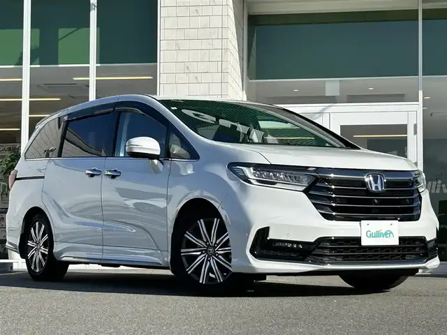 ホンダ オデッセイ ハイブリッド e:HEVアブソルート 兵庫県 2021(令3)年 5.7万km プラチナホワイトパール 純正10インチナビ/フルセグテレビ/BTオーディオ/CD/DVD再生機能/純正フリップダウンモニター/全方位カメラ/ETC2.0/パワーシート/両側パワースライドドア/LEDヘッドライト/ハーフレザーシート/2列目オットマン/純正17インチAW