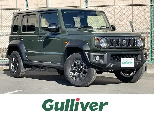 スズキ ジムニー ノマド FC 東京都 2025(令7)年 0.1千km 緑 登録済未使用車　/セーフティサポート　/ＬＥＤヘッドライト　/アイドリングストップ　/クルーズコントロール　/車線逸脱警報機能　/後退時ブレーキサポート　/ハイビームアシスト　/標識認識機能　/デュアルカメラブレーキ/プッシュエンジンスタート/ダウンヒルアシスト/プッシュエンジンスタ-ト/クリアランスソナー