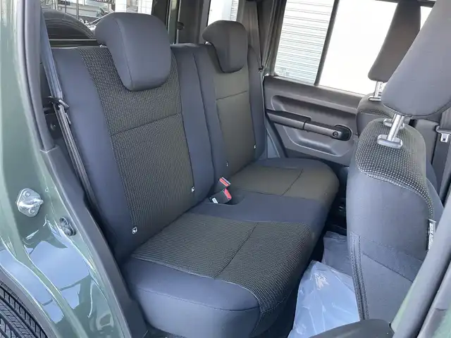 スズキ ジムニー ノマド FC 東京都 2025(令7)年 0.1千km 緑 登録済未使用車　/セーフティサポート　/ＬＥＤヘッドライト　/アイドリングストップ　/クルーズコントロール　/車線逸脱警報機能　/後退時ブレーキサポート　/ハイビームアシスト　/標識認識機能　/デュアルカメラブレーキ/プッシュエンジンスタート/ダウンヒルアシスト/プッシュエンジンスタ-ト/クリアランスソナー