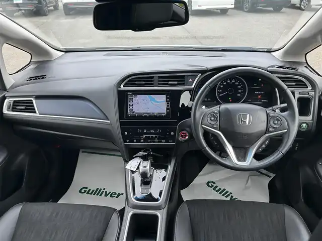 ホンダ シャトル ハイブリッド X ホンダセンシング 山形県 2020(令2)年 8万km プラチナホワイトパール ホンダセンシング/純正メモリナビ/　　【CD DVD BT フルセグ USB AUX】/バックカメラ/レーダークルーズコントロール/LEDオートヘッドライト/ハーフレザーシート/シートヒーター/アイドリングストップ/ステアリングスイッチ/パドルシフト/電動格納ウィンカーミラー/フォグランプ/スマートキー×2/ETC