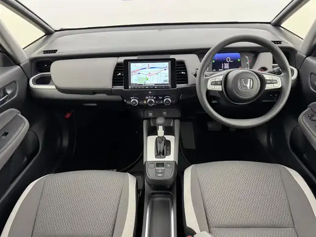 ホンダ フィット e:HEVクロスター 福岡県 2020(令2)年 0.7万km クリスタルブラックパール 純正８型ナビ／フルセグＴＶ　/バックカメラ　/アダプティブクルコン　/コーナーセンサー　/衝突軽減ブレーキ　/レーンキープ　/アクセル踏み間違い防止　/ＥＣＯＮ　/プッシュスタート　/純正１６インチＡＷ　/ＬＥＤライト