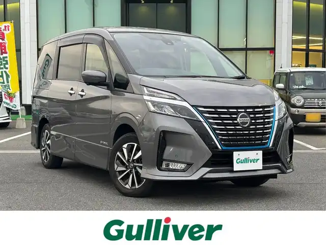日産 セレナ e－パワー ハイウェイスター V 奈良県 2022(令4)年 1.9万km ダークメタルグレー 純正10インチナビ/（フルセグ/BT/CD/DVD）/純正フリップダウンモニター/プロパイロット/アラウンドビューモニター/ブラインドスポットモニター/衝突軽減システム/前後コーナーセンサー/レーンキープアシスト/両側パワースライドドア/前席シートヒーター/ステアリングヒーター/後席サンシェード/前方ドライブレコーダー/ETC/純正16インチAW/取り扱い説明書/スペアキーX1
