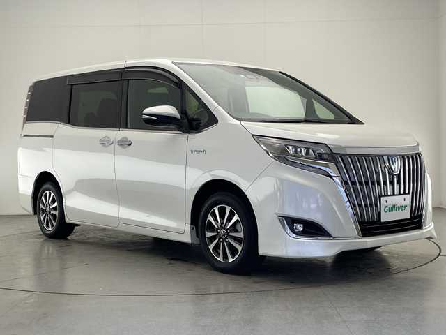 トヨタ エスクァイア ハイブリッド Gi プレミアムパッケージ 宮崎県 2018(平30)年 5.3万km ホワイトパールクリスタルシャイン ・トヨタセーフティセンス/・レーンキープアシスト/・オートハイビーム/・純正9インチナビ（Bluetooth/フルセグTV/SD/AM/FM/CD/DVD）/・純正12.1インチフリップダウンモニター/・バックカメラ/・両側パワースライドドア/・クルーズコントロール/・ハーフレザーシート/・前席シートヒーター/・ハンドルヒーター/・オートライト/・オートハイビーム/・スマートキー/プッシュスタート/・純正フロアマット/・ドライブレコーダー/・ビルトインETC2.0
