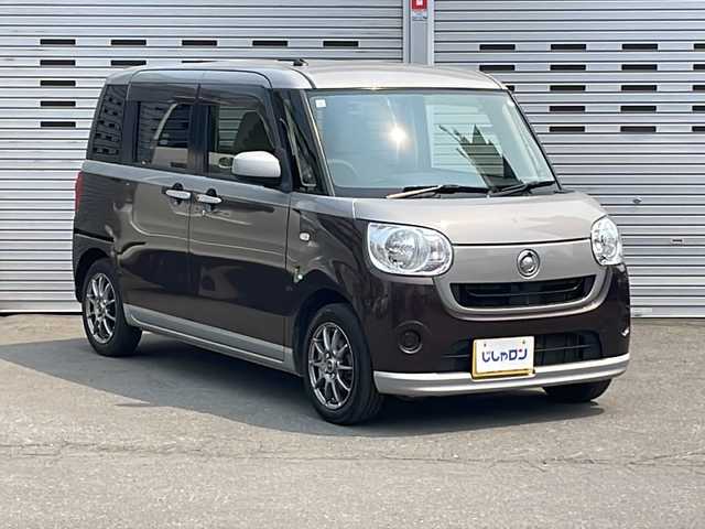 ダイハツ ムーヴ キャンバス X 道央・札幌 2017(平29)年 12.5万km スムースグレーマイカメタリック/プラムブラウンクリスタルマイカ 2トーン (株)IDOMが運営する【じしゃロン札幌店】の自社ローン専用車両になります。こちらは現金またはオートローンご利用価格です。自社ローンご希望の方は別途その旨お申し付けください。//4WD//スマートキー//スペアキー1本//冬タイヤ積載//社外ナビSD//DVD再生//Bluetooth接続//フルセグテレビ//スライドドア両側//ベンチシート//社外アルミホイール//ABS//ヘッドライトLED//横滑り防止装置//レーンアシスト//ダブルエアバック//セキュリティアラーム