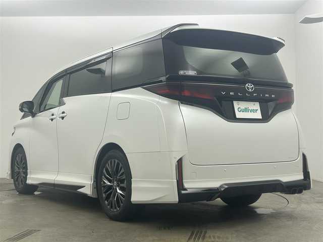 トヨタ ヴェルファイア Z プレミア 岡山県 2023(令5)年 1.5万km プラチナホワイトパールマイカ GRエアロ/GRマフラー/デジタルインナーミラー/左右独立ムーンルーフ/純正１４インチディスプレイオーディオ/【ナビ/Bluetooth/フルセグTV/Carplay/HDMI/USB】/茶色レザーシート/トヨタ チームメイト/　・アドバンスト　パーク/　・アドバンスト　ドライブ/トヨタセーフティーセンス/　・プリクラッシュセーフティ/　・レーントレーシングアシスト/　・レーダークルーズコントロール/　・アダプティブハイビームシステム/　・ロードサインアシスト/　・フロントクロストラフィックアラート/パノラミックビューモニター/1列目＆2列目シートヒーター/1列目＆2列目エアシート/ビルトインＥＴＣ２．０/１００Ｖ電源/三眼ＬＥＤヘッドライト/パドルシフト/置くだけ充電/両側電動スライドドア