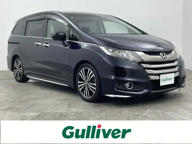 ホンダ オデッセイ アブソルート EX 大分県 2013(平25)年 10万km プレミアムヴィーナスブラックP Hondaインターナビ＋リンクアップフリー＋ＥＴＣ（ナビ連動）/ マルチビューカメラシステム＋スマートパーキングアシストシステム/ リアエンターテインメントシステム/リア左側パワースライドドア＋スライドドアイージークローザー/リア右側パワースライドドア＋スライドドアイージークローザー/LEDアウターウエルカムライト（リアドア＜左右＞）/２列目プレミアムクレイドルシート/コンフォートビューパッケージ/Hondaスマートキーシステム＋プッシュエンジンスタート／ストップスイッチ/トリプルゾーンコントロール・フルオートエアコンディショナー/運転席8ウェイパワーシート/ＬＥＤヘッドライト/ＬＥＤルームランプ/あんしんパッケージ/18インチアルミホイール/ 	ＡＣＣ＋ＣＭＢＳ