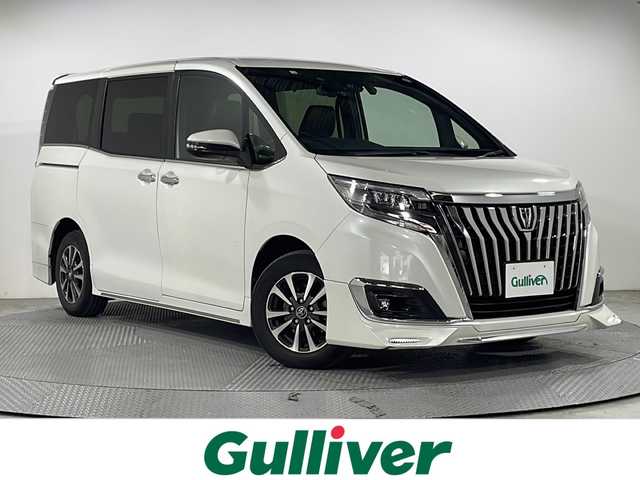 トヨタ エスクァイア Gi プレミアムパッケージ 広島県 2018(平30)年 6万km ホワイトパールクリスタルシャイン 純正10型ナビ（DVD/フルセグTV/Bluetooth）/純正フリップダウンモニター/両側パワースライドドア/バックカメラ/シートヒーター/ステアリングヒーター/セーフティセンス/・プリクラッシュセーフティ/・レーンディパーチャーアラート/・オートマチックハイビーム/クルーズコントロール/LEDヘッドランプ/純正15インチAW/ビルトインETC/ドライブレコーダー