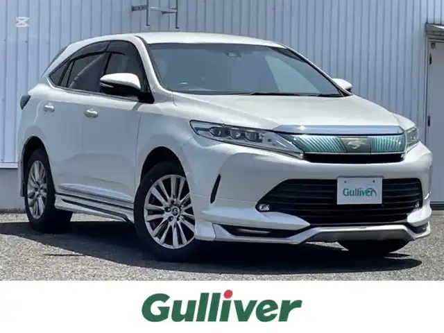 トヨタ ハリアー プレミアム 熊本県 2018(平30)年 6.9万km ホワイトパールクリスタルシャイン 社外ナビ/・AM/FM/CD/DVD/SD/iPod/BT/・フルセグTV/バックカメラ/トヨタセーフティセンス/・レーンディパーチャーアラート/・インテリジェントクリアランスソナー/・プリクラッシュセーフティ/・レーダークルーズコントロール/前後コーナーセンサー/革巻きステアリング/・ステアリングリモコン/・オートチルトアウェイ＆リターン機能/ハーフレザーシート/・D席パワーシート/オートライト/・LEDライト/電動格納ミラー/・ウィンカーミラー/MODELISTA/電動サイドブレーキ/・ホールドボタン/ETC/パワーバックドア/純正ドアバイザー/純正フロアマット/純正アルミホイール/スマートキー