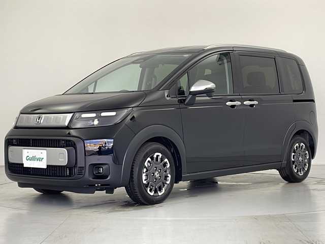 ホンダ フリード ハイブリット e:HEV クロスター 愛知県 2025(令7)年 0.1千km クリスタルブラックパール 登録済未使用車/ホンダセンシング/・衝突軽減ブレーキ/・誤発進抑制機能/・後方誤発進抑制機能/・近距離衝突軽減ブレーキ/・歩行者事故低減ステアリング/・路外逸脱抑制機能/・渋滞追従付アダプティブクルーズコントロール/・トラフィックアラート/・先行車発進のお知らせ/・オートハイビーム/・パーキングセンサー/純正ナビ/・AppleCarPlay/Android Auto/・Bluetooth/・フルセグTV/・FM/AM/バックカメラ/両側パワースライドドア/純正アルミホイール/ハーフレザーシート/シートヒーター/LEDヘッドライト/スマートキー/プッシュスタート/横滑り防止装置