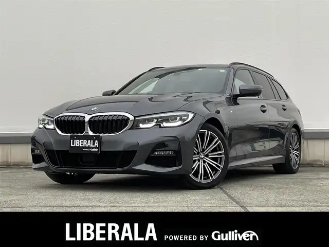 ＢＭＷ ３２０ｄ xDrive ツーリング Mスポーツ 東京都 2022(令4)年 2万km ミネラルグレー パノラマスライディングルーフ/ライブコックピット/アダプティブクルーズコントロール/ブラインドスポットモニター/衝突被害軽減ブレーキ/バックモニター/純正LEDヘッドライト/ワイヤレスチャージ/シートヒーター/ハーフレザー/パドルシフト/ETC2.0/ステアリングスイッチ/電動リアゲート/純正ナビ/バックモニター
