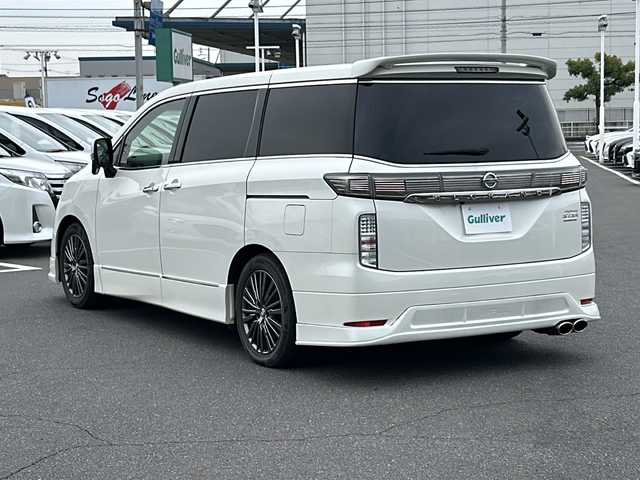 日産 エルグランド 250HWS プレミアム アーバンクロム 岡山県 2015(平27)年 5.2万km ブリリアントホワイトパール 純正メモリーナビ/バックカメラ　/純正フリップダウンモニター　/デジタルインナーミラー　/両側パワースライドドア　/ＩＭＰＡＬエアロ　/メモリー付パワーシート　/シートヒーター　/オットマン　/スマートキー　/ＥＴＣ/プッシュスタート/オートライト