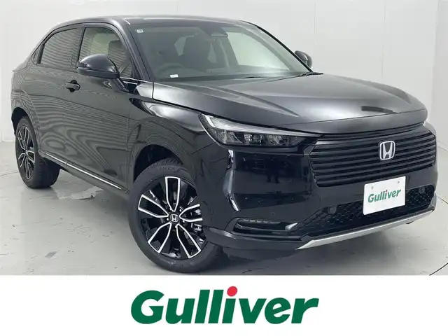 ホンダ ヴェゼル ハイブリッド e:HEV Z 茨城県 2025(令7)年 0.1千km クリスタルブラックパール 9インチHonda CONNECTディスプレー/・バックカメラ/・FM/AM/USB/Bluetooth/フルセグTV/・Apple CarPlay/Android　Auto/BSM/ワイヤレス受電/ビルドインETC2.0/パワーバックドア/ステアリングヒーター/運転席＆助手席シートヒーター/前後コーナーセンサー/Honda SENSING/・アダプティブクルーズコントロール/・誤発進抑制機能/・レーンキープアシスト/・近距離衝突軽減ブレーキ/パドルシフト/ハーフレザーシート/LEDヘッドライト/オートハイビーム/オートライト/オットマン