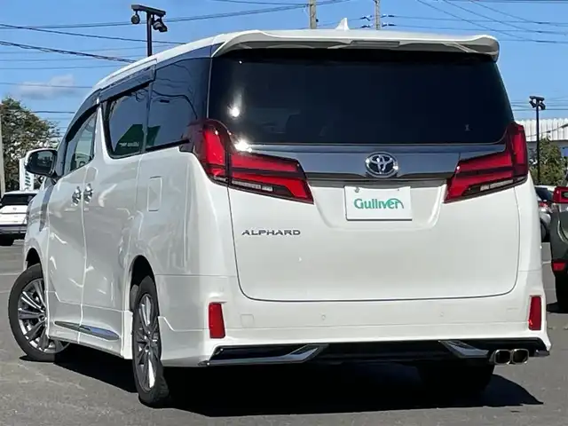 トヨタ アルファード S タイプゴールドⅡ 道央・札幌 2021(令3)年 2.8万km ホワイトパールクリスタルシャイン ４WD/モデリスタエアロ/純正ナビ/AM/FM/USB/BT/トヨタセーフティセンス/プリクラッシュセーフティ/横滑り防止装置/レーダークルーズコントロール/レーンキープアシスト/クリアランスソナー/ブラインドスポットモニター/パーキングサポートブレーキ/リアクロストラフィックアラート/ロードサインアシスト/バックカメラ/ビルトインETC2.0/ドライブレコーダー/アイドリングストップ/ECOMODE/デジタルインナーミラー/両側パワースライドドア/パワーバックドア/2列目オットマン/ハーフレザーシート/革巻きステアリング/ステアリングリモコン/AC100V/電動パーキング/ブレーキホールド/MTモード付AT/プッシュスタート/スマートキー/LEDヘッドライト/オートライト/フォグランプ/電動格納ミラー/ウィンカーミラー/フロアマット/ドアバイザー