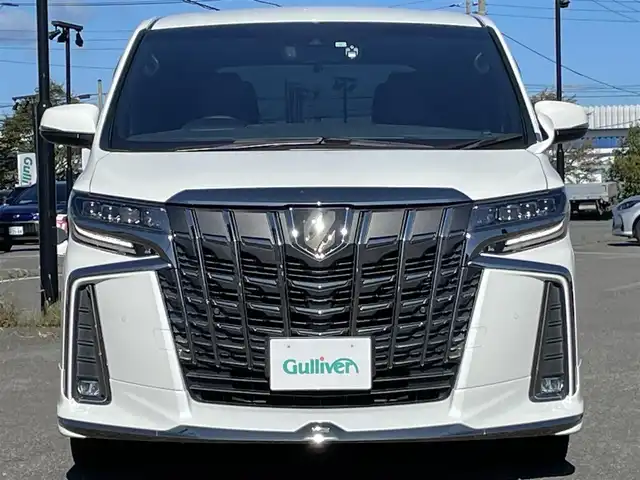 トヨタ アルファード S タイプゴールドⅡ 道央・札幌 2021(令3)年 2.8万km ホワイトパールクリスタルシャイン ４WD/モデリスタエアロ/純正ナビ/AM/FM/USB/BT/トヨタセーフティセンス/プリクラッシュセーフティ/横滑り防止装置/レーダークルーズコントロール/レーンキープアシスト/クリアランスソナー/ブラインドスポットモニター/パーキングサポートブレーキ/リアクロストラフィックアラート/ロードサインアシスト/バックカメラ/ビルトインETC2.0/ドライブレコーダー/アイドリングストップ/ECOMODE/デジタルインナーミラー/両側パワースライドドア/パワーバックドア/2列目オットマン/ハーフレザーシート/革巻きステアリング/ステアリングリモコン/AC100V/電動パーキング/ブレーキホールド/MTモード付AT/プッシュスタート/スマートキー/LEDヘッドライト/オートライト/フォグランプ/電動格納ミラー/ウィンカーミラー/フロアマット/ドアバイザー