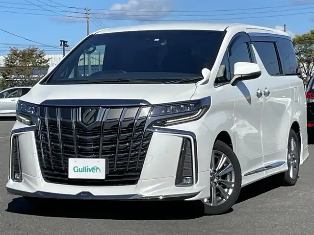 トヨタ アルファード S タイプゴールドⅡ 道央・札幌 2021(令3)年 2.8万km ホワイトパールクリスタルシャイン ４WD/モデリスタエアロ/純正ナビ/AM/FM/USB/BT/トヨタセーフティセンス/プリクラッシュセーフティ/横滑り防止装置/レーダークルーズコントロール/レーンキープアシスト/クリアランスソナー/ブラインドスポットモニター/パーキングサポートブレーキ/リアクロストラフィックアラート/ロードサインアシスト/バックカメラ/ビルトインETC2.0/ドライブレコーダー/アイドリングストップ/ECOMODE/デジタルインナーミラー/両側パワースライドドア/パワーバックドア/2列目オットマン/ハーフレザーシート/革巻きステアリング/ステアリングリモコン/AC100V/電動パーキング/ブレーキホールド/MTモード付AT/プッシュスタート/スマートキー/LEDヘッドライト/オートライト/フォグランプ/電動格納ミラー/ウィンカーミラー/フロアマット/ドアバイザー