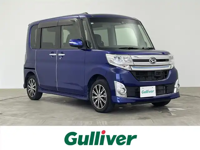 ダイハツ タント カスタム X トップED SAⅡ 大分県 2015(平27)年 5.6万km ディープブルークリスタルマイカ ワンオーナー/禁煙車/純正8型ナビ/・フルセグTV、DVD再生可、AM/FM/・Bluetooth、HDMI、USB/ステアリングスイッチ/バックカメラ/左側電動スライドドア/スマートアシスト2/・衝突被害軽減ブレーキ/・車線逸脱警報/・誤発進抑制機能（前後）/・先行車発進お知らせ/オートライト/LEDヘッドランプ/LEDフォグランプ/プッシュスタート/スマートキー×2/リアサンシェード/純正14インチアルミホイール/純正シートカバー/純正フロアマット（ラバー）/純正ドアバイザー/点検記録簿（H28.6/H29.7/H31.7/R5.7）