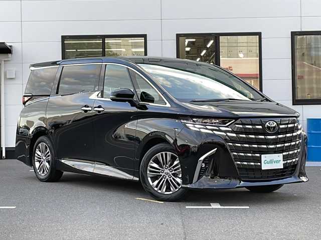 トヨタ アルファードハイブリット Z 山口県 2024(令6)年 1.7万km ブラック メーカーOP左右独立ムーンルーフ/メーカーOPユニバーサルサイドステップ/純正14インチディスプレーオーディオPlus/・コネクティッドナビ対応/・Bluetooth/AM/FM/・HDMI入力端子/・フルセグテレビ/パノラミックビューモニター/ビルトインETC2.0/デジタルインナーミラー/Toyota Safety Sense/・ドライバーモニター/・プリクラッシュセーフティ/・レーントレーシングアシスト/・レーンチェンジアシスト/・レーンディパーチャーアラート/・プロアクティブドライビングアシスト/・フロントクロストラフィックアラート/・発進遅れ告知機能/・ロードサインアシスト/・レーダークルーズコントロール/・ドライバー異常時対応システム/・ブラインドスポットモニター/・後方車両接近告知/・パーキングサポートブレーキ/・オートマチックハイビーム/メーカーOP後席用パワーサイドサンシェード/AC100V/ワイヤレス充電/全席パワーシート/ステアリングヒーター/シートヒーター/ベンチレーション/スペアキー/両側パワースライドドア/パワーバックドア/純正18インチアルミホイール/純正3眼LEDヘッドライト/保証書