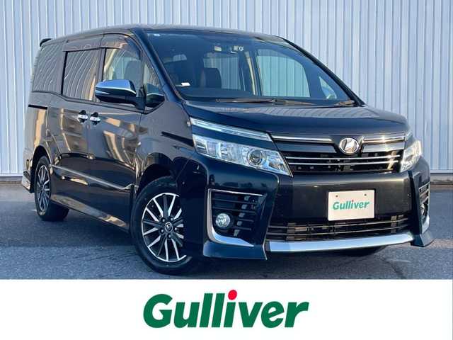 トヨタ ヴォクシー ZS 煌 滋賀県 2015(平27)年 4.4万km ブラッキッシュアゲハガラスフレーク 純正SDナビ/・CD/DVD/・Bluetooth/・フルセグTV/バックカメラ/フリップダウンモニター/ステアリングスイッチ/革巻きステアリング/ETC/両側パワースライドドア/横滑り防止機能/オートマチックヘッドライト/LEDヘッドライト/フォグランプ/オートリトラミラー/スマートキー