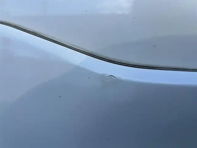 トヨタ ヴォクシー ハイブリッド ZS 煌 岡山県 2018(平30)年 9.9万km ホワイトパールクリスタルシャイン 登録時走行距離98348km/TRDエアロ/純正9インチナビ/フルセグTV(AM.FM.CD.DVD.TV.BT)/両側パワースライドドア/バックカメラ/ETC/シートヒーター/クリアランスソナー/衝突軽減ブレーキ/横滑り防止装置/クルーズコントロール/車線逸脱警報（レーンキープアシスト）/オートライト/オートマチックハイビーム/アイドリングストップ/16インチ純正AW/純正フロアマット/スペアキー/LEDヘッドライト/取扱説明書