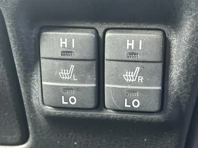 トヨタ ヴォクシー ハイブリッド ZS 煌 岡山県 2018(平30)年 9.9万km ホワイトパールクリスタルシャイン 登録時走行距離98348km/TRDエアロ/純正9インチナビ/フルセグTV(AM.FM.CD.DVD.TV.BT)/両側パワースライドドア/バックカメラ/ETC/シートヒーター/クリアランスソナー/衝突軽減ブレーキ/横滑り防止装置/クルーズコントロール/車線逸脱警報（レーンキープアシスト）/オートライト/オートマチックハイビーム/アイドリングストップ/16インチ純正AW/純正フロアマット/スペアキー/LEDヘッドライト/取扱説明書