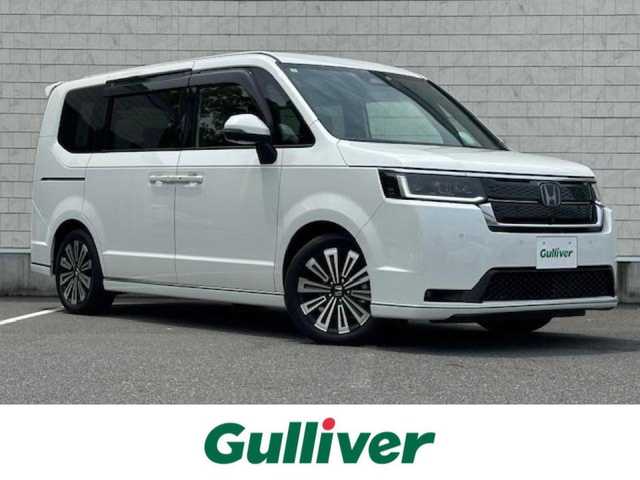 ホンダ ステップワゴン スパーダ eHEV プレミアムライン 大阪府 2023(令5)年 0.3万km プラチナホワイトパール 純正9型ナビ(LXM-247FNi)/Bluetooth/フルセグ/DVD/CD/USB/アラウンドビューモニター/ホンダセンシング/ブラインドスポットモニター/両側パワースライドドア/電動リアゲート/オットマンチェア/シートヒーターD+N/ハーフレザーシート/ドライブレコーダー/ETC/LEDヘッドライト/スマートキー×2