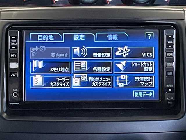 トヨタ ヴォクシー ZS 佐賀県 2008(平20)年 10.5万km ホワイトパールクリスタルシャイン 純正ディーラーオプションナビ（NHZN-W57）/CD/DVD/フルセグTV/バックカメラ/アルパイン製　10.2インチ　フリップダウンモニター/両側パワースライドドア/ETC/パドルシフト/MTモード付AT/デュアルオートエアコン/キセノンライト/フォグランプ/電動格納ミラー/純正アルミホイール/フロアマット/プッシュスタート/スマートキー