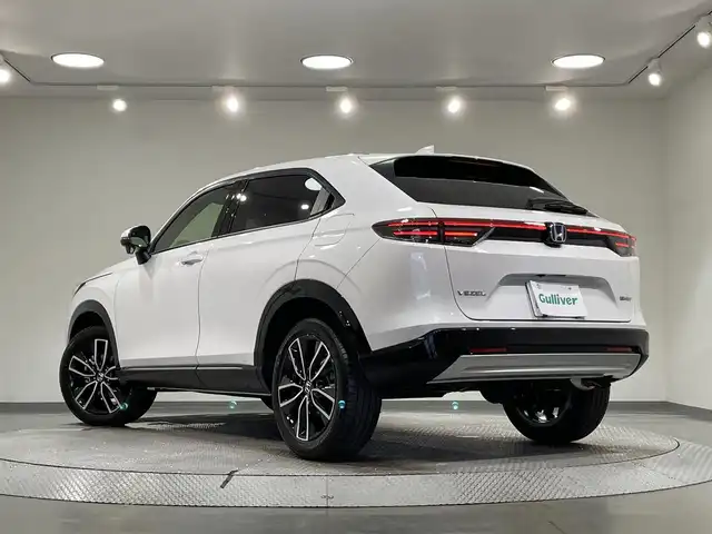 ホンダ ヴェゼル ハイブリッド e:HEV Z 愛知県 2025(令7)年 0.1千km プラチナホワイトパール 登録済未使用車/純正９インチナビ/衝突軽減ブレーキ/レーダークルーズコントロール/ブラインドスポットモニター/クリアランスソナー/車線逸脱警報/パワーバックドア/ヒルディセントコントロール/電動パーキングブレーキ/ブレーキホールド/パドルシフト/ワイヤレス充電/ハーフレザーシート/シートヒーター/ハンドルヒーター/バックカメラ/ビルトインＥＴＣ2.0/USB入力端子/ISOFIX/純正18インチアルミホイール