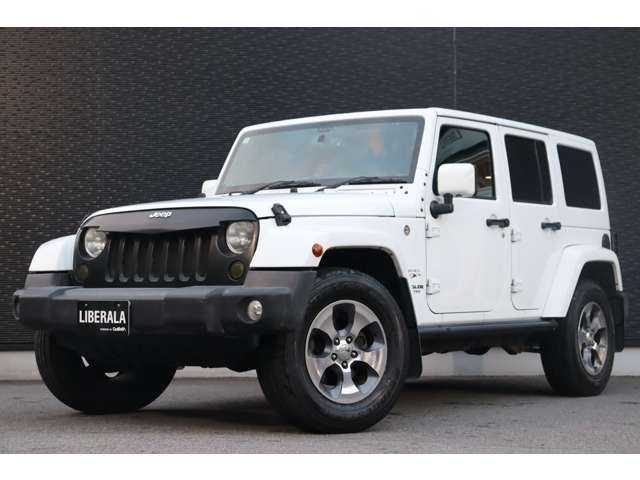 クライスラー・ジープ ジープ ラングラー アンリミテッド サハラ 大分県 2016(平28)年 9.6万km ブライトホワイト 当店買取車両/社外グリル/サイドステップ/ＡＬＰＩＮＥサウンド/クルーズコントロール/社外ナビ/地デジ/Bluetooth/バックカメラ/サイドカメラ/茶本革/シートヒーター/社外ＬＥＤヘッドライト/オートライト/Ｆ／Ｒフォグ/純正１８インチＡＷ/ＥＴＣ