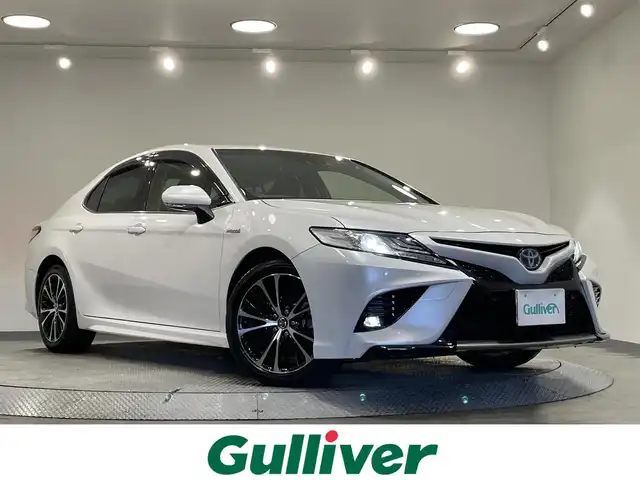 トヨタ カムリ WSレザーパッケージ 愛知県 2019(平31)年 6万km プラチナホワイトパールマイカ 純正８インチナビ/ＪＢＬプレミアムサウンドシステム/レーダークルーズコントロール/プリクラッシュセーフティ/ブラインドスポットモニター/クリアランスソナー/レーンディパーチャーアラート/先行車発進告知/ヘッドアップディスプレイ/パドルシフト/電動パーキングブレーキ/ブレーキホールド/レザーシート/シートヒーター/前後ドライブレコーダー/ビルトインＥＴＣ２．０/レーダー探知機【動作未確認】/AV100V1500Wコンセント/USB入力端子/アクセサリーソケット/ISOFIX/LEDヘッドライト/純正フロアマット/純正18インチアルミホイール