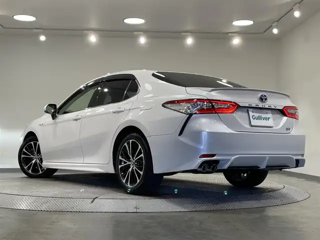 トヨタ カムリ WSレザーパッケージ 愛知県 2019(平31)年 6万km プラチナホワイトパールマイカ 純正８インチナビ/ＪＢＬプレミアムサウンドシステム/レーダークルーズコントロール/プリクラッシュセーフティ/ブラインドスポットモニター/クリアランスソナー/レーンディパーチャーアラート/先行車発進告知/ヘッドアップディスプレイ/パドルシフト/電動パーキングブレーキ/ブレーキホールド/レザーシート/シートヒーター/前後ドライブレコーダー/ビルトインＥＴＣ２．０/レーダー探知機【動作未確認】/AV100V1500Wコンセント/USB入力端子/アクセサリーソケット/ISOFIX/LEDヘッドライト/純正フロアマット/純正18インチアルミホイール